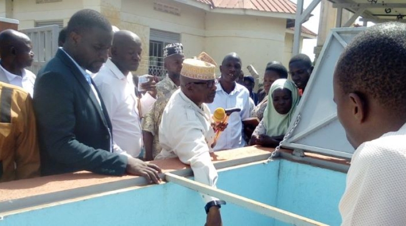 Mayuge RDC, Lt. Hajji Walugembe Aramandhani, officially commissions the solar-powered water supply system in Mitimito village (November 2025).