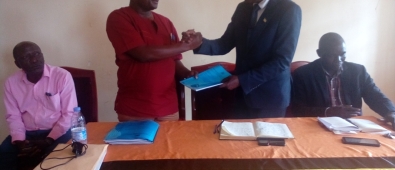 Mayuge District outgoing CAO, Mr. Magumba Eria (standing left) handed over office to new CAO, Mr. Eswilu Donath on Friday 12th Jan 2024