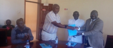 Outgoing District Chairperson (right) handing over office to CAO
